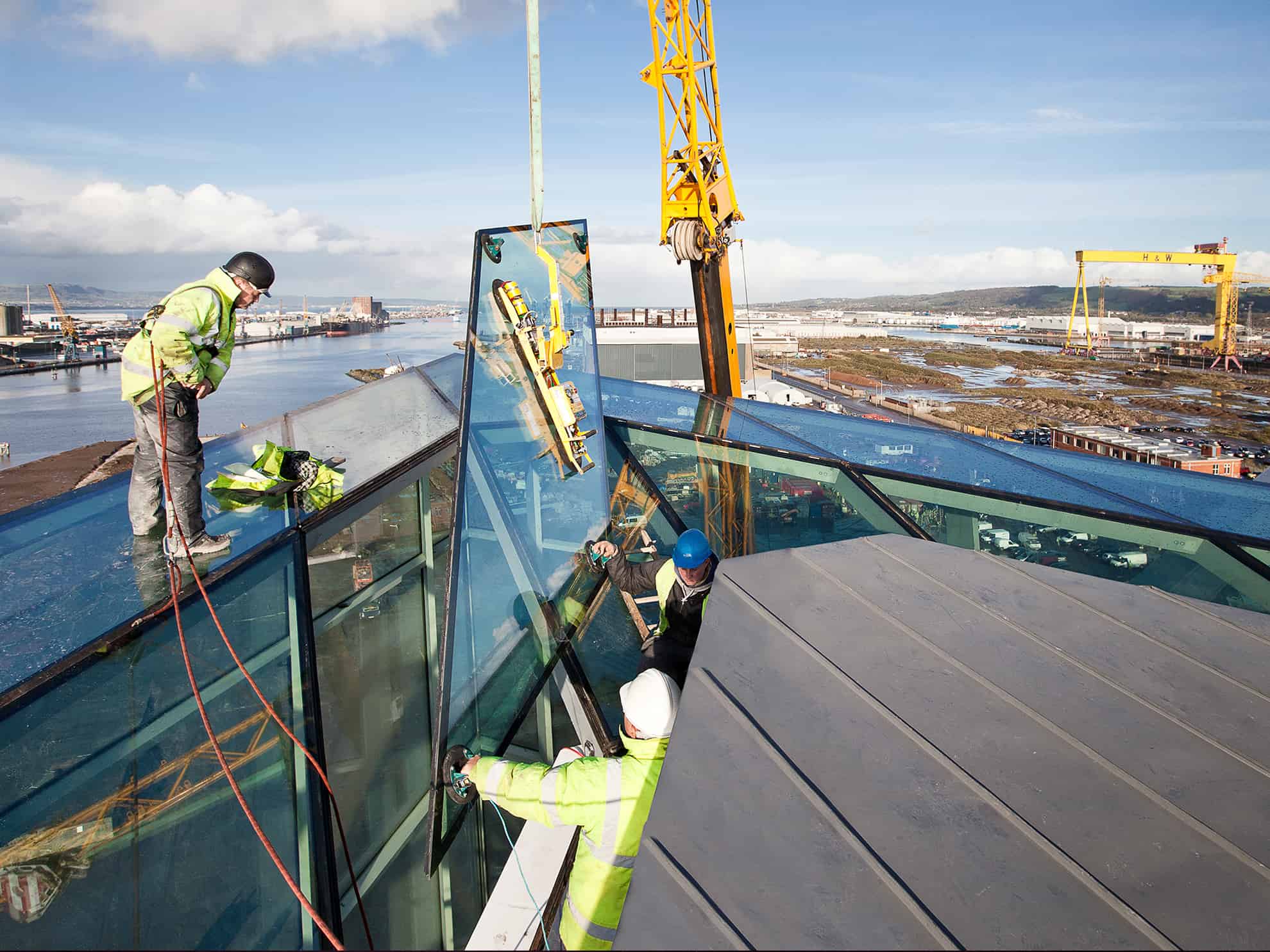 Men installing Glass on Titanic Belfast